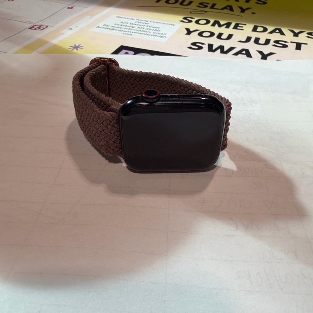 Apple Watch with Brown Band and Black Face